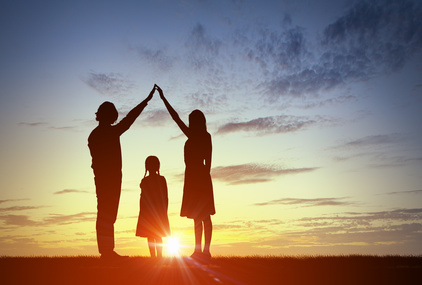 Silhouettes of happy family of three people mother father and child